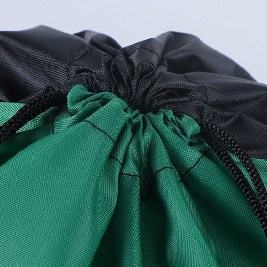  Dual zipper polyester drawstring bag with earphone hole and mesh pockets

