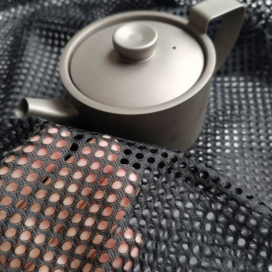 Black drawstring mesh bag with round bottom for outdoor storage