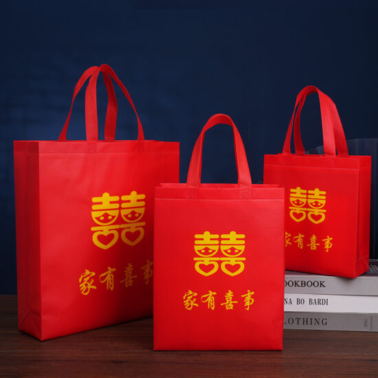 Large red non-woven waterproof wedding gift bag with handle