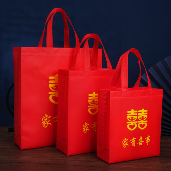 Large red non-woven waterproof wedding gift bag with handle